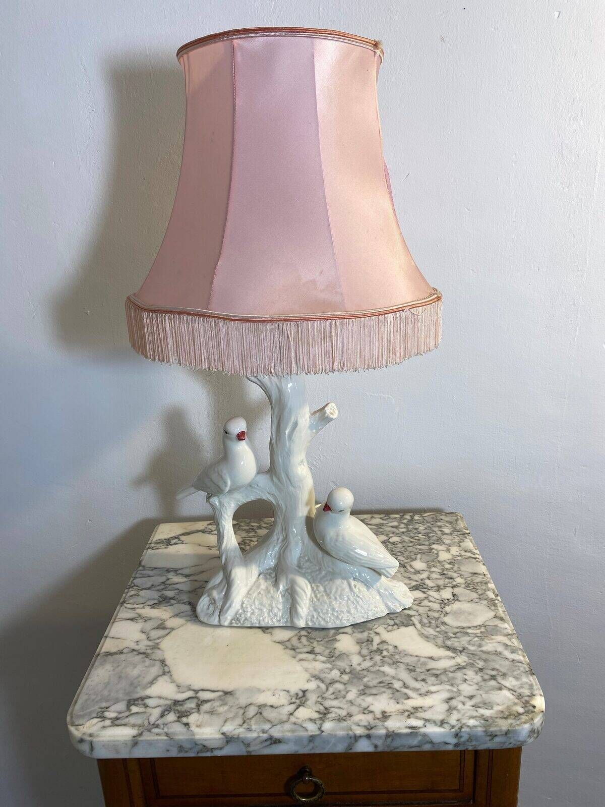 Ceramic lamp with birds, pink fringed shade, 1950s.