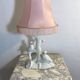 Ceramic lamp with birds, pink fringed shade, 1950s.