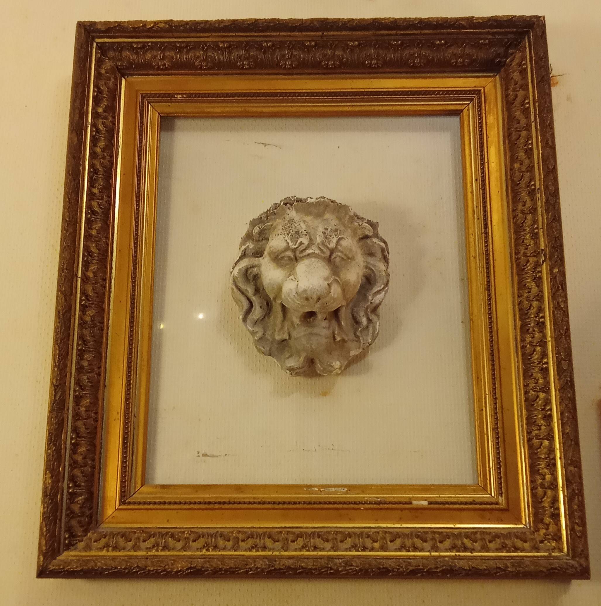Antique large gilded frame with lion head ornament on plexiglass