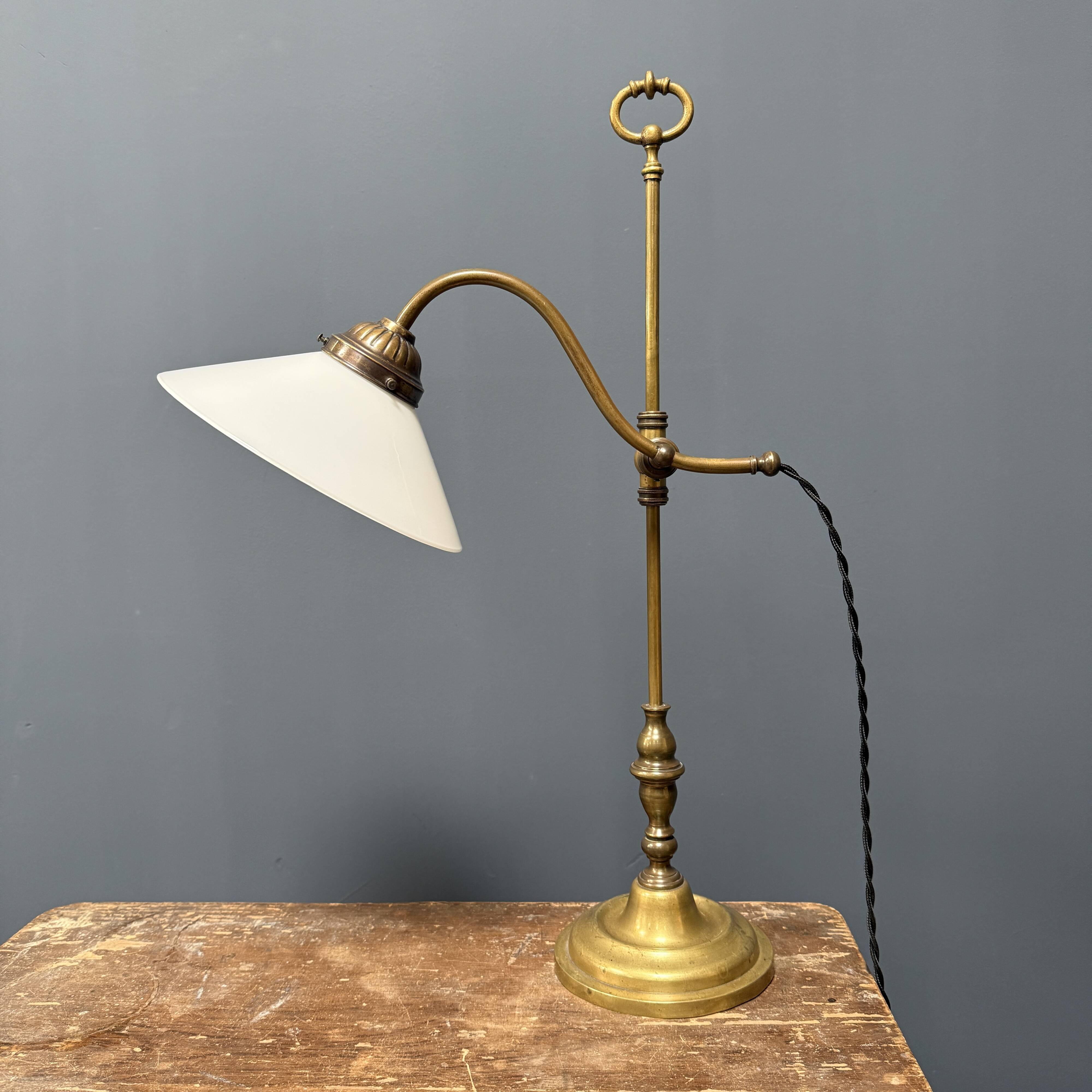 Adjustable brass table lamp with opaline glass shade