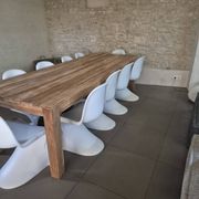 10 white chairs in the style of Verner Panton
