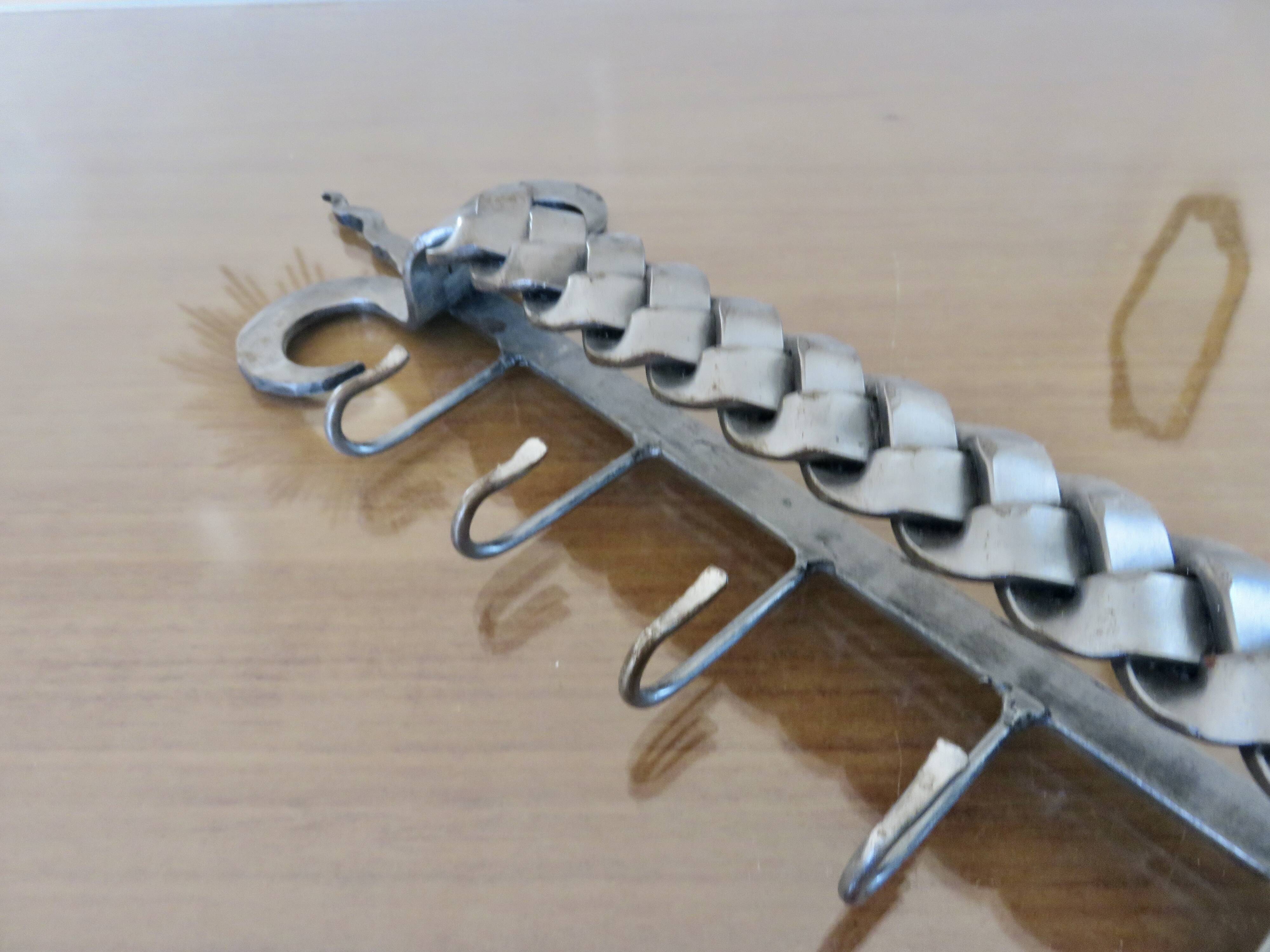 2 Tea towel holders, ironwork in braided raw steel, 1970