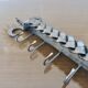 2 Tea towel holders, ironwork in braided raw steel, 1970