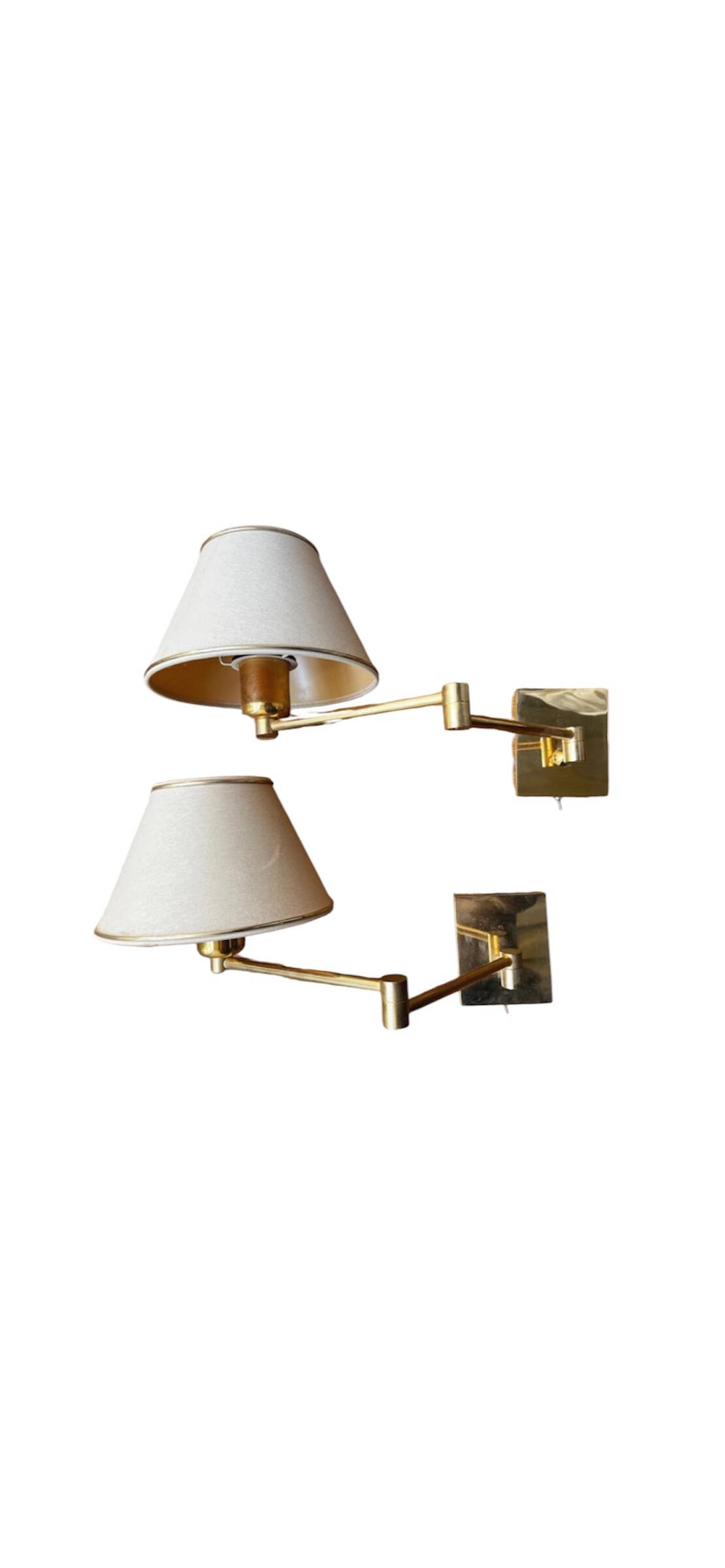 Pair of vintage brass wall lights with adjustable arms.