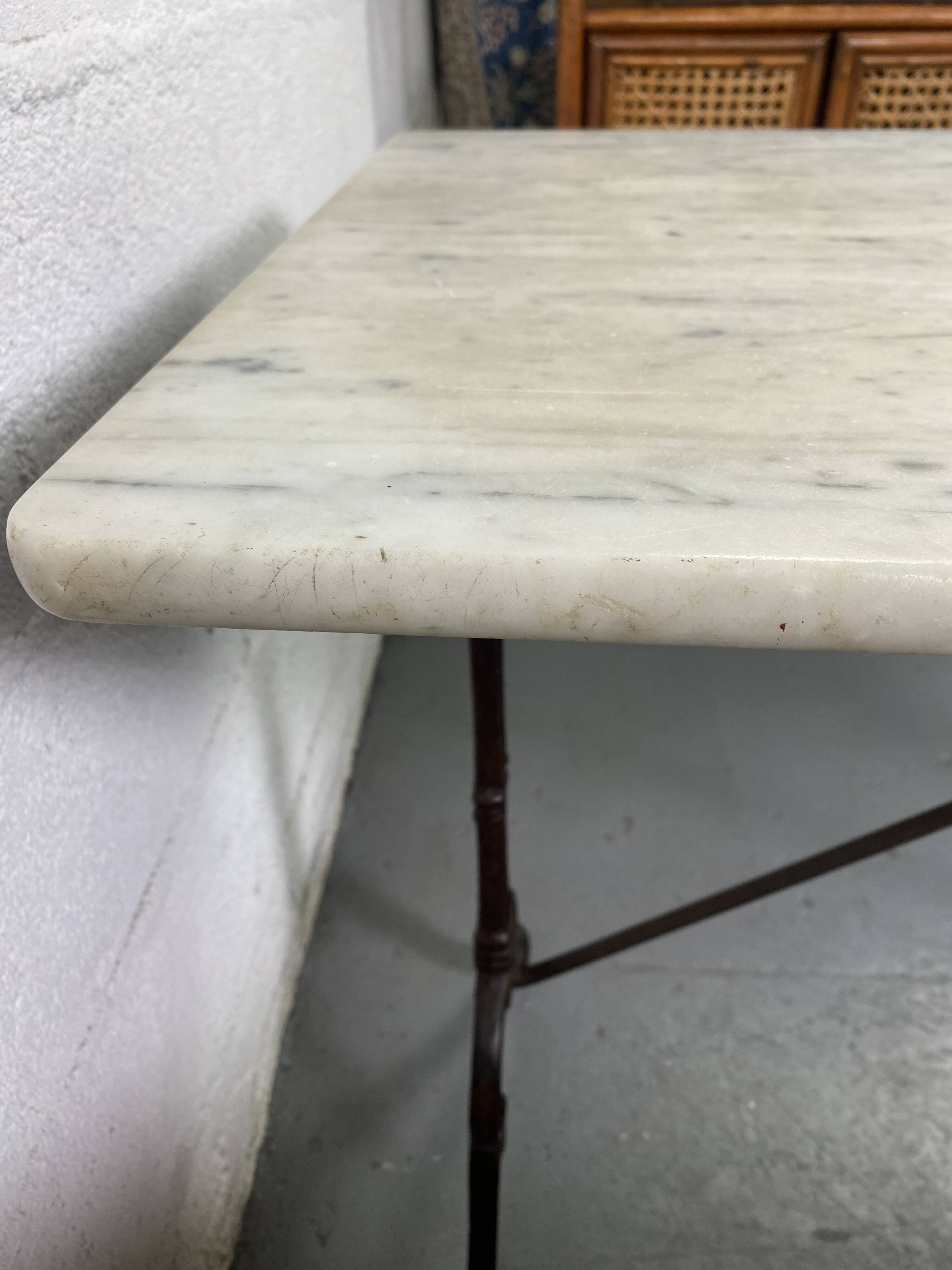 Set of two bistro tables in marble and wrought iron