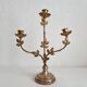 Antique bronze and brass candlestick with golden leaves