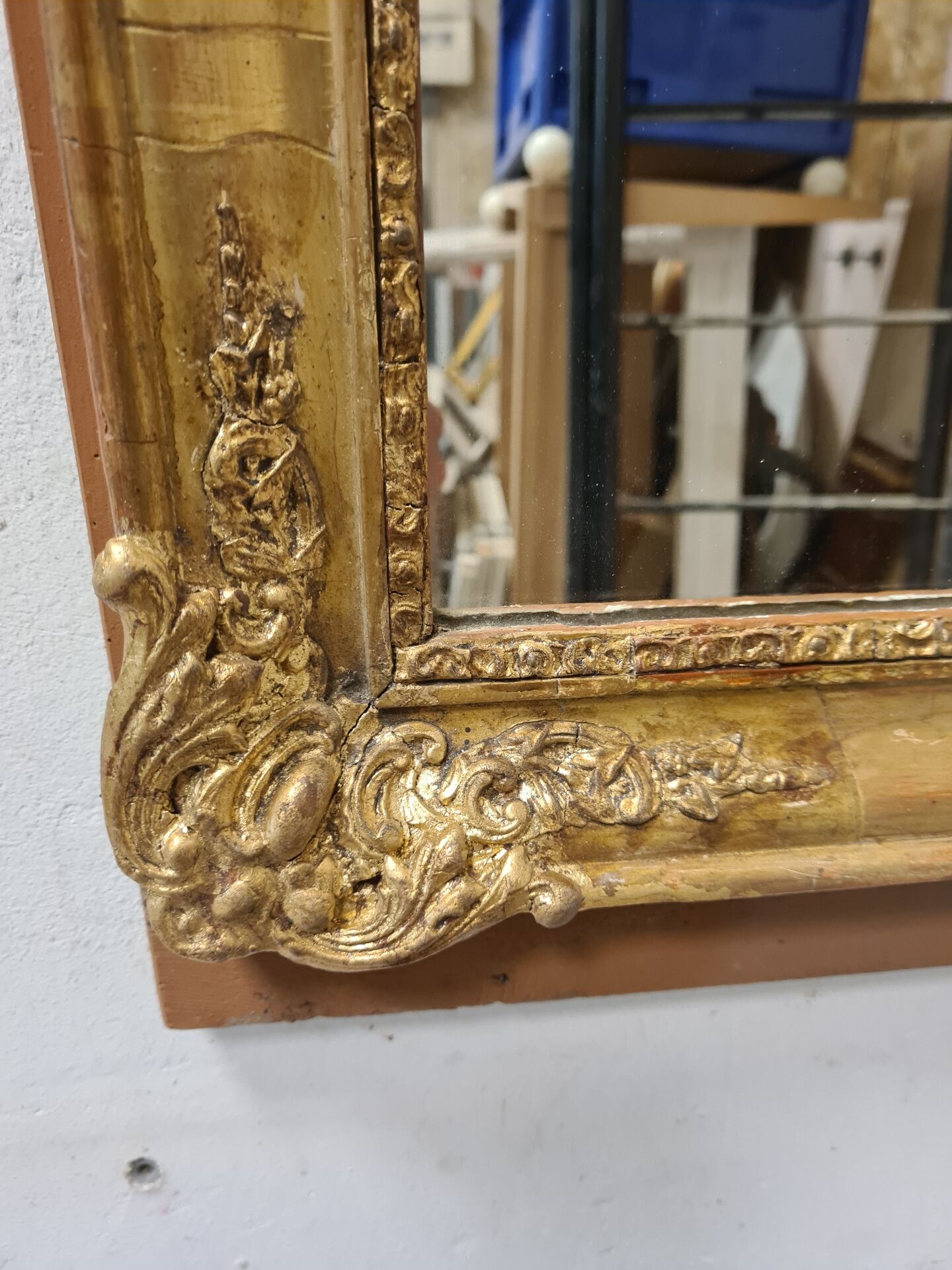 Antique gilded mirror, 19th century Empire style.