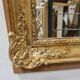 Antique gilded mirror, 19th century Empire style.