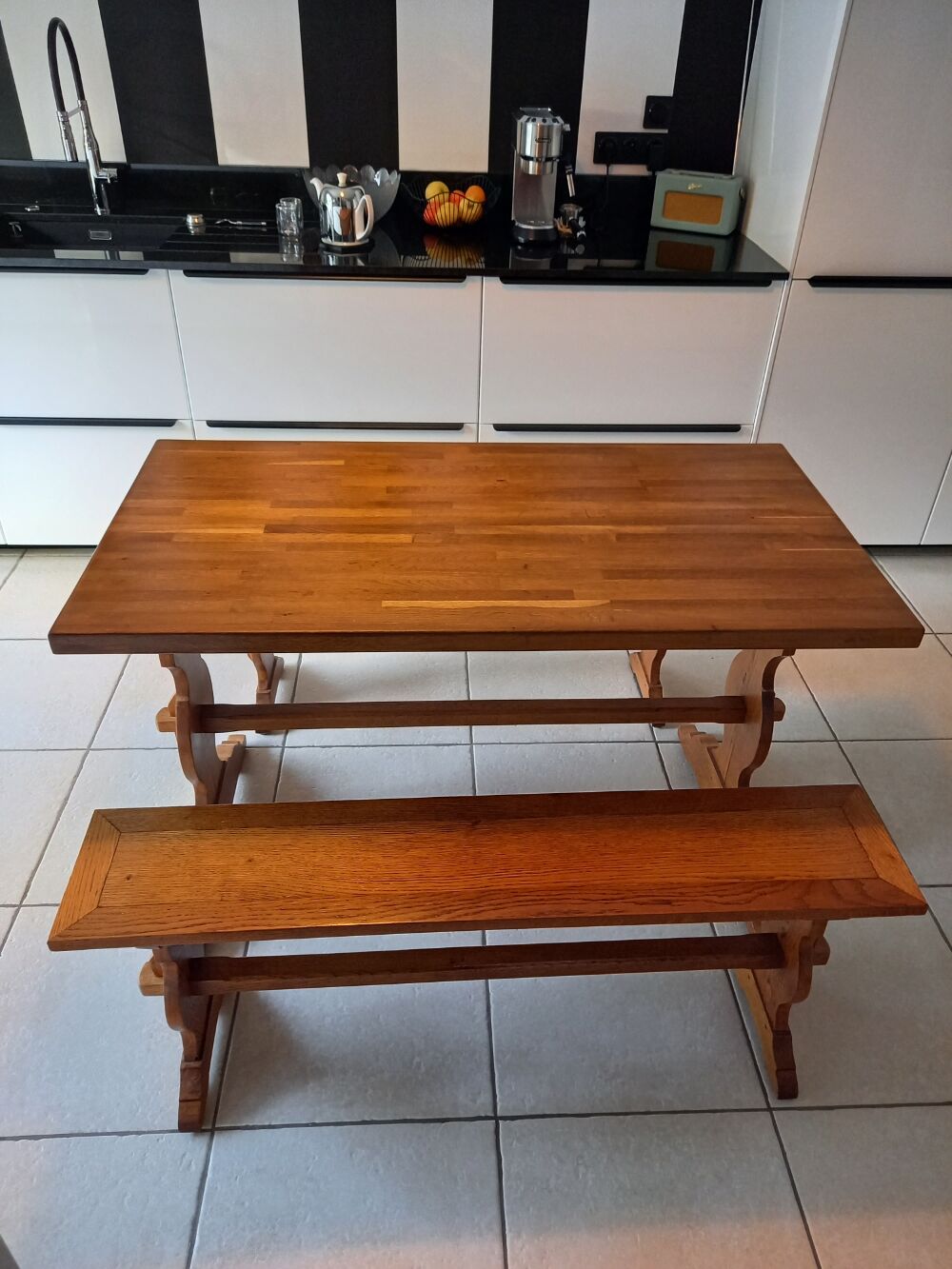Solid oak table and its two benches made by a craftsman.