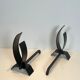 Pair of modernist andirons in steel and wrought iron