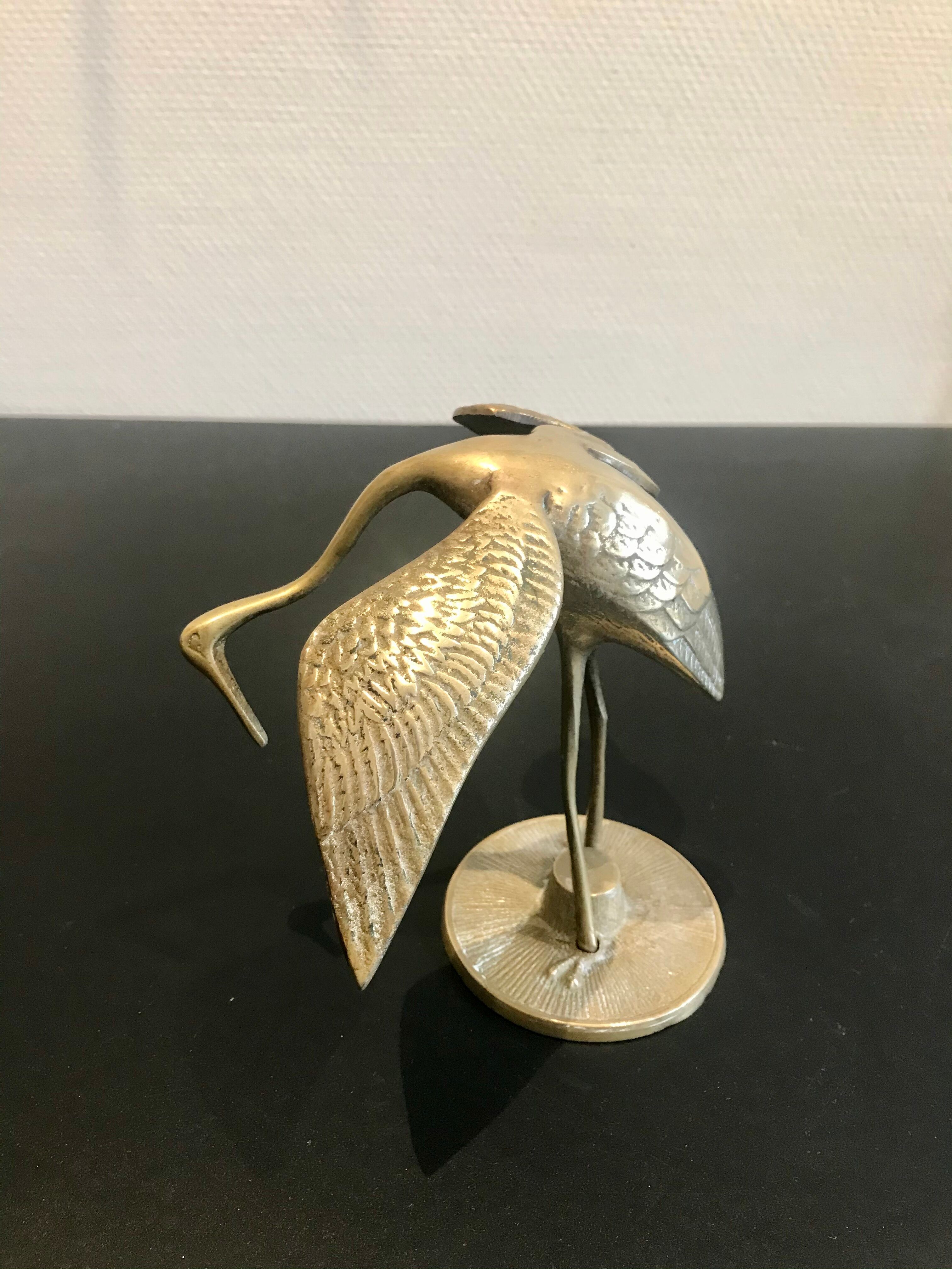 Couple of brass birds