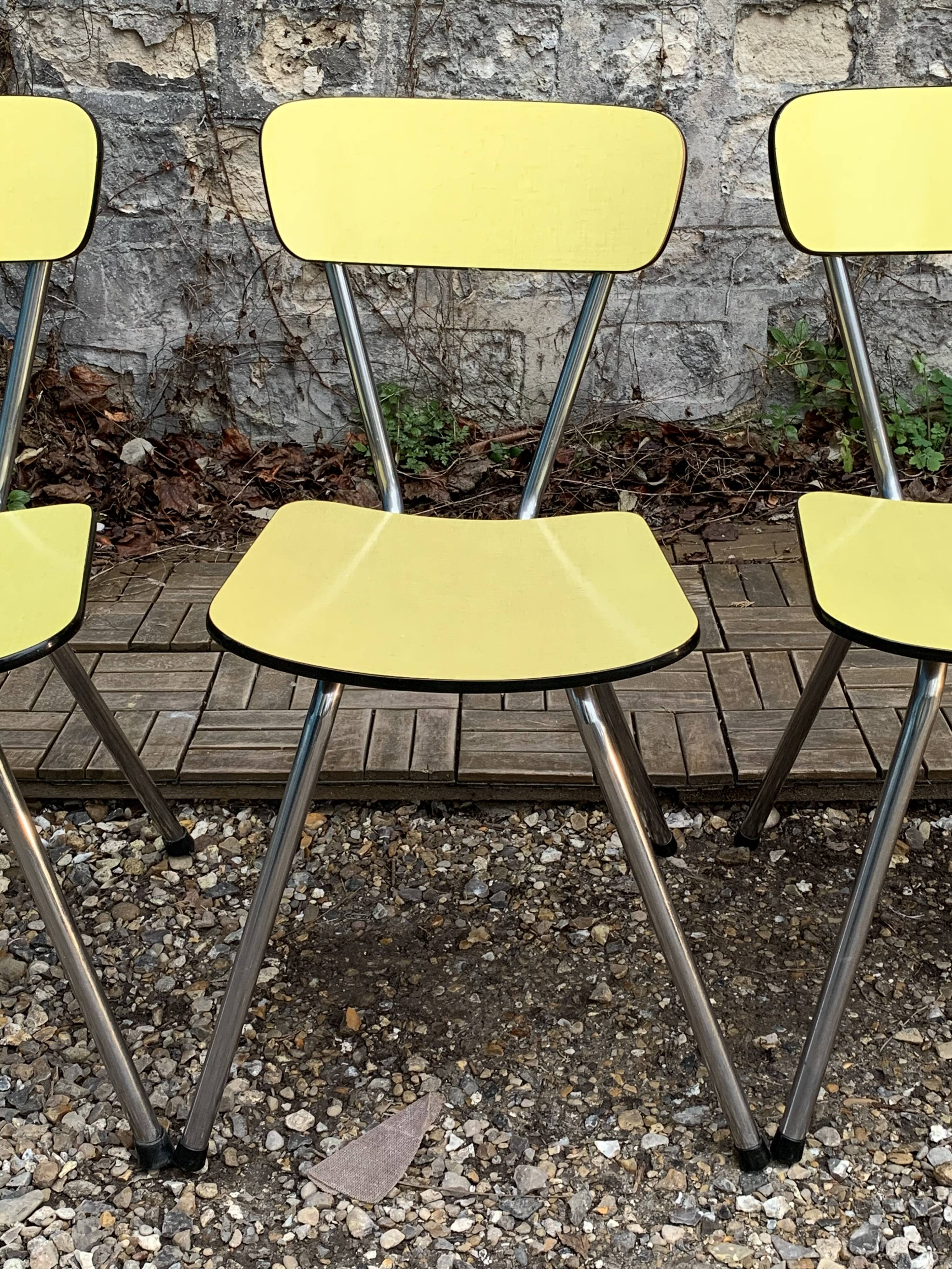 Yellow Formica chairs with compass legs, 1950s
