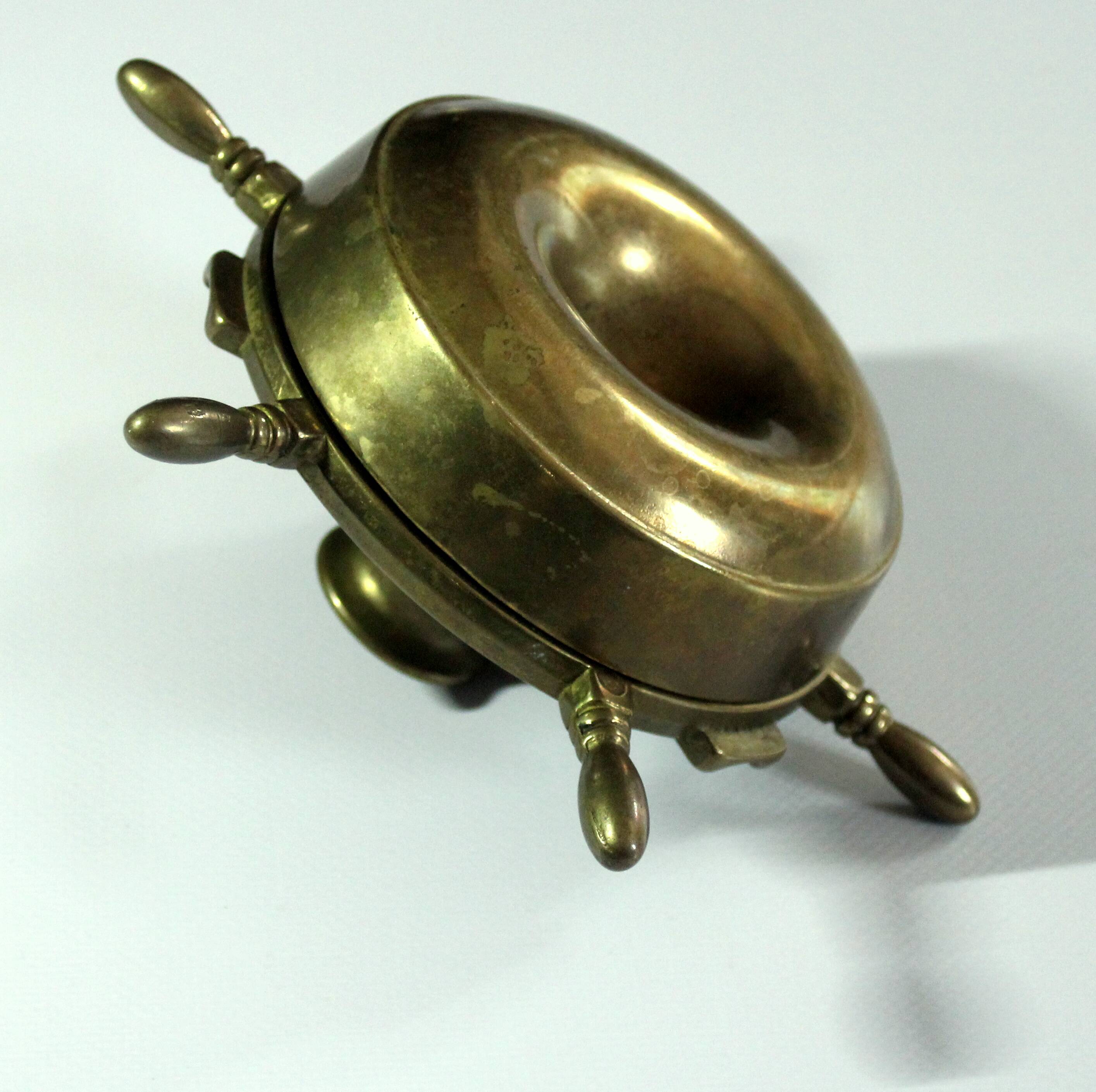 1960s solid brass ashtray in the shape of a steering wheel with a candle stick, vintage