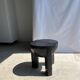 Black mango wood tripod side table with a semi-spherical top, height: 45 cm, diameter: 44 cm.