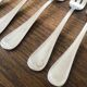 8 mismatched fish forks, silver metal