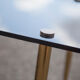 Smoked glass coffee table with adjustable brass legs, end of sofa, 70s table