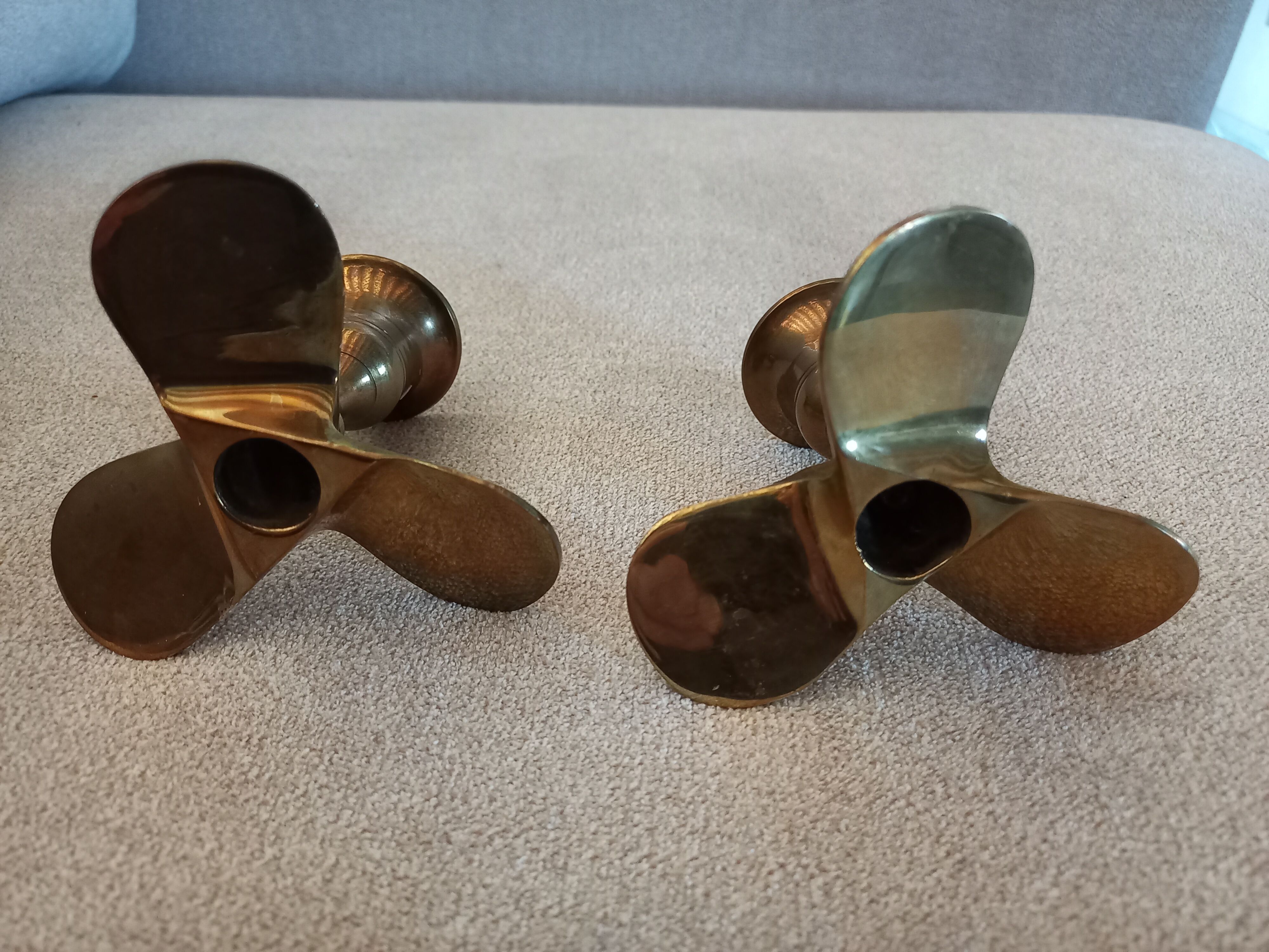 Pair of vintage propeller shape brass candle holders