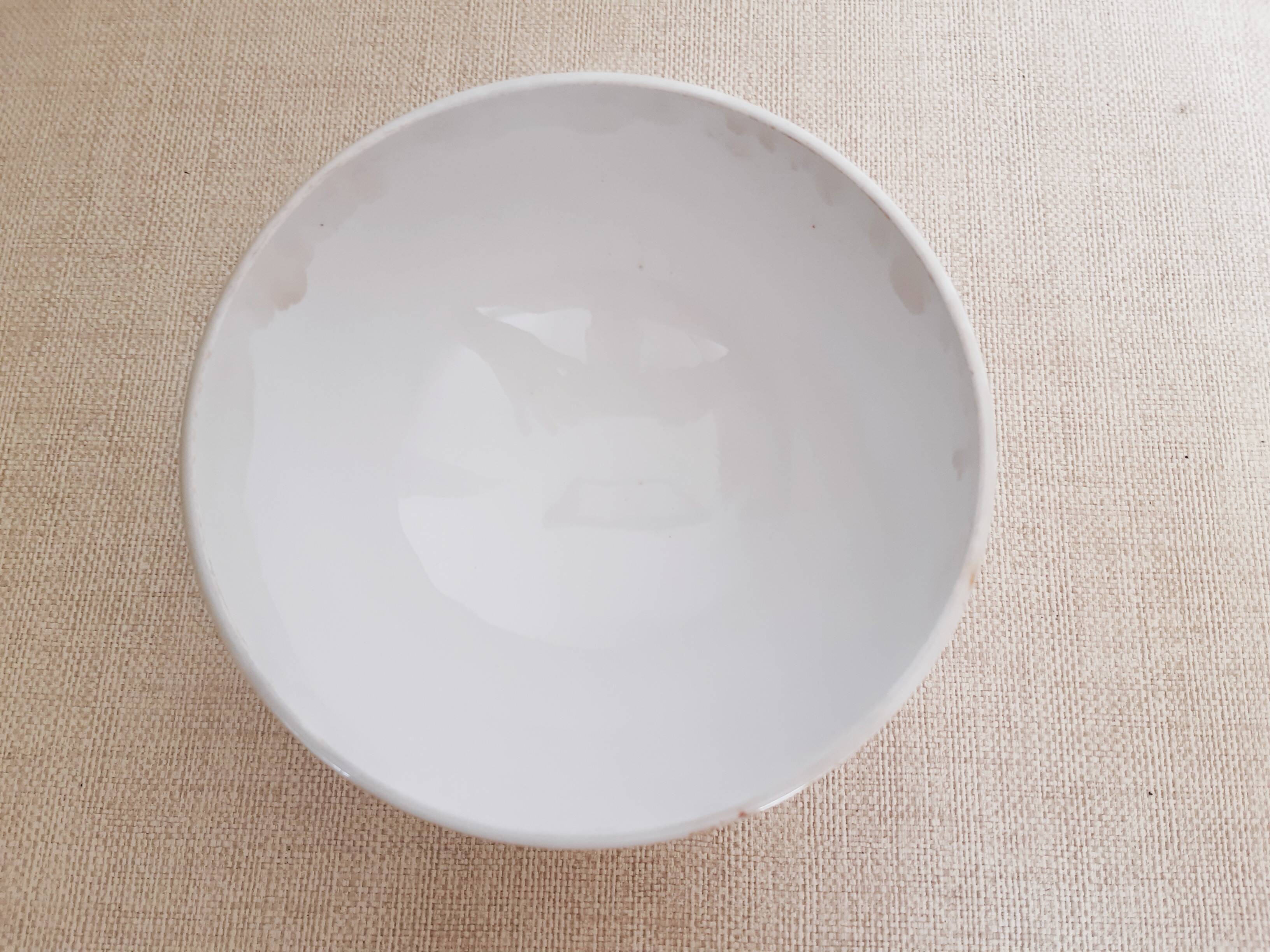 Large old bowl with piedouche in ochre yellow earthenware