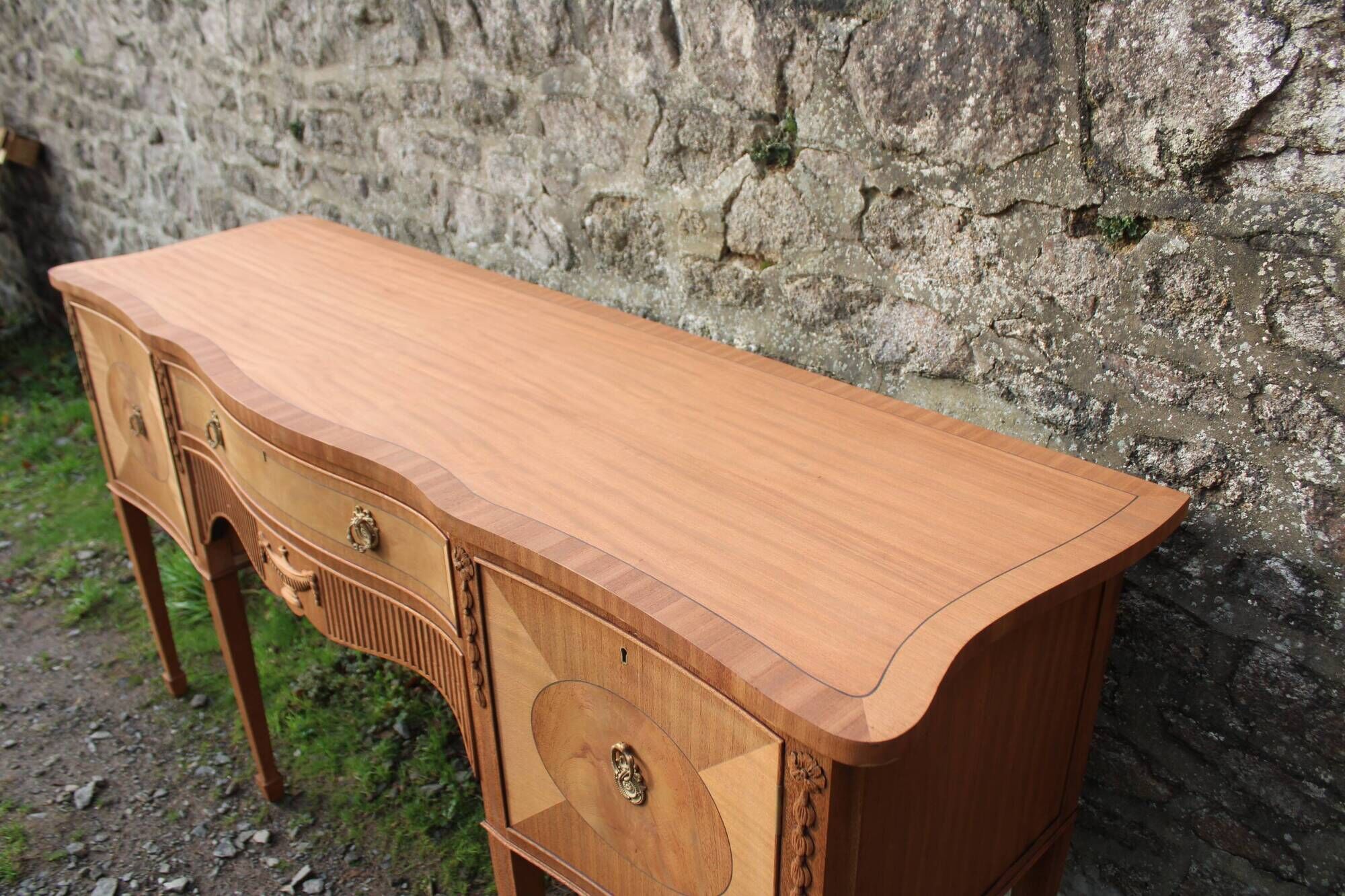 English-made enfilade in Louis XVI style with light wood veneers.