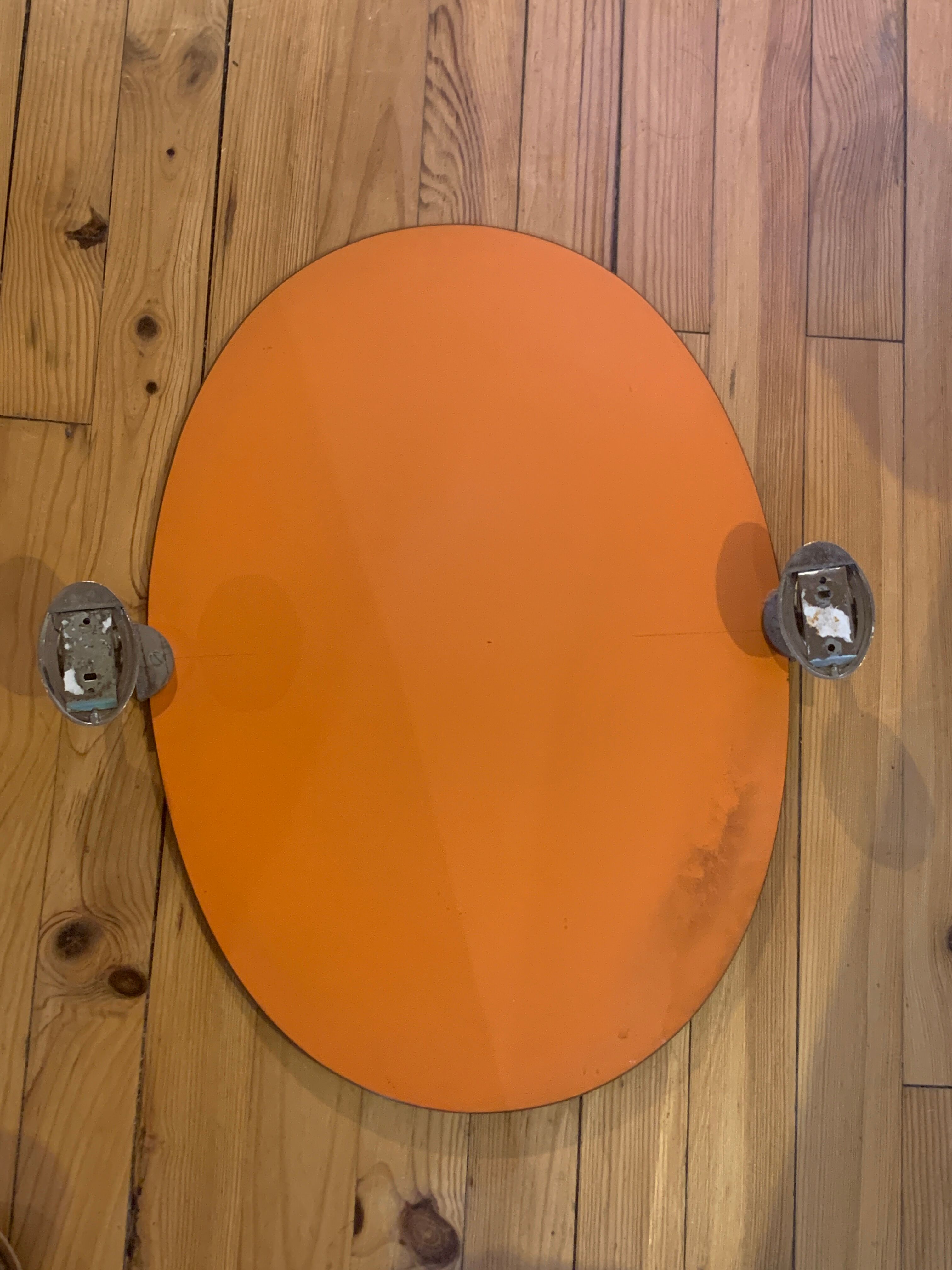 Adjustable oval beveled mirror