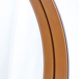 Round mirror covered with leather and chrome, made in France in the 1970s.