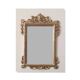 Mirror with a carved wooden frame in an antique style in pure gold.