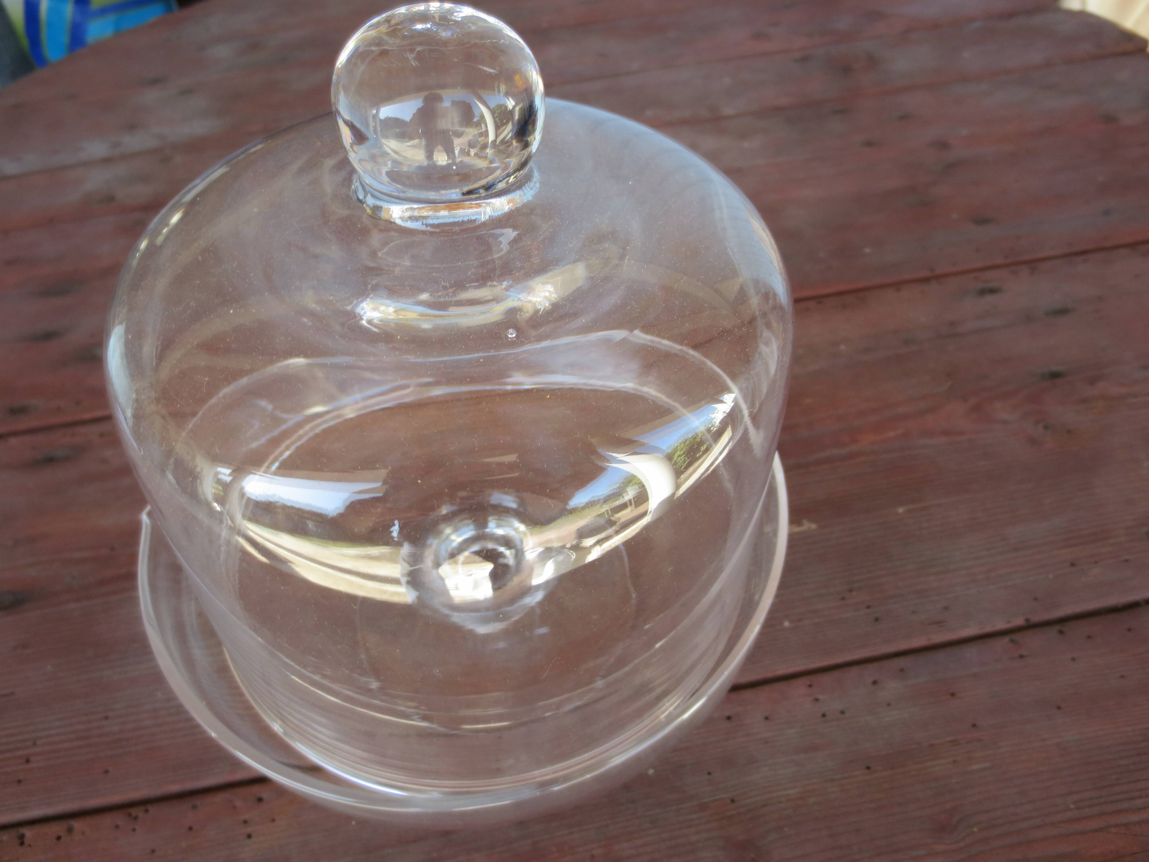 Old glass cake dome on a stand