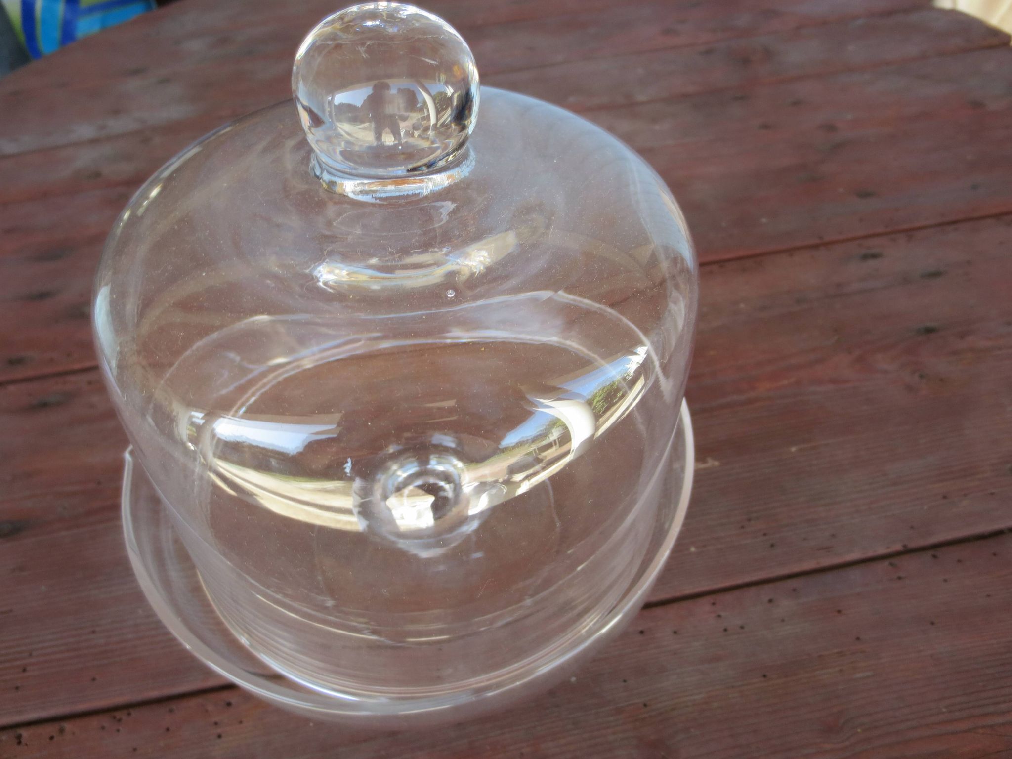 Old glass cake dome on a stand