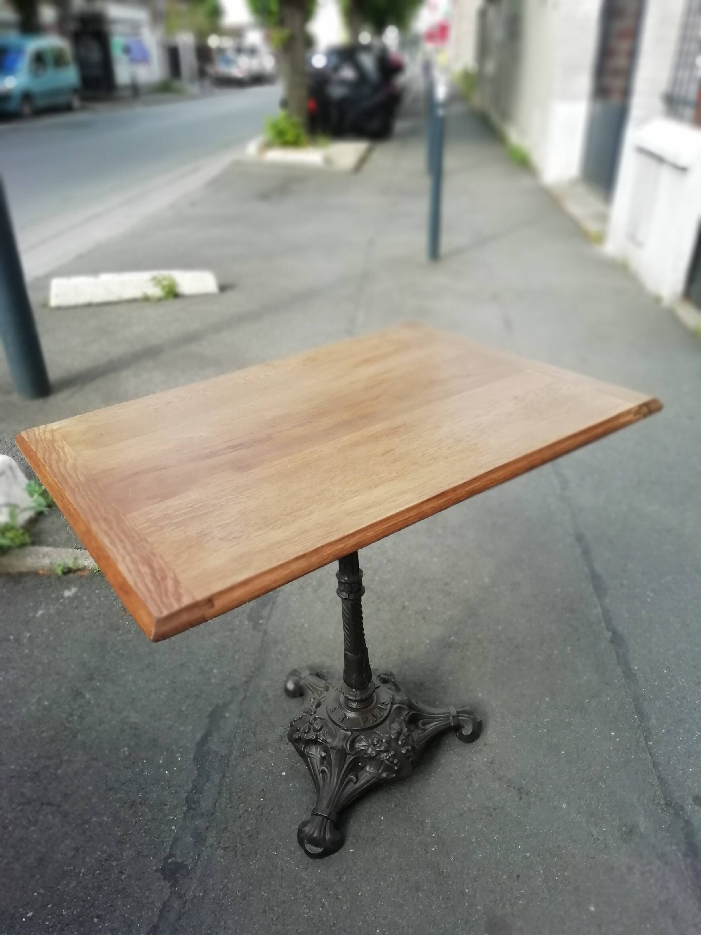 Bistro side table in oak and cast iron