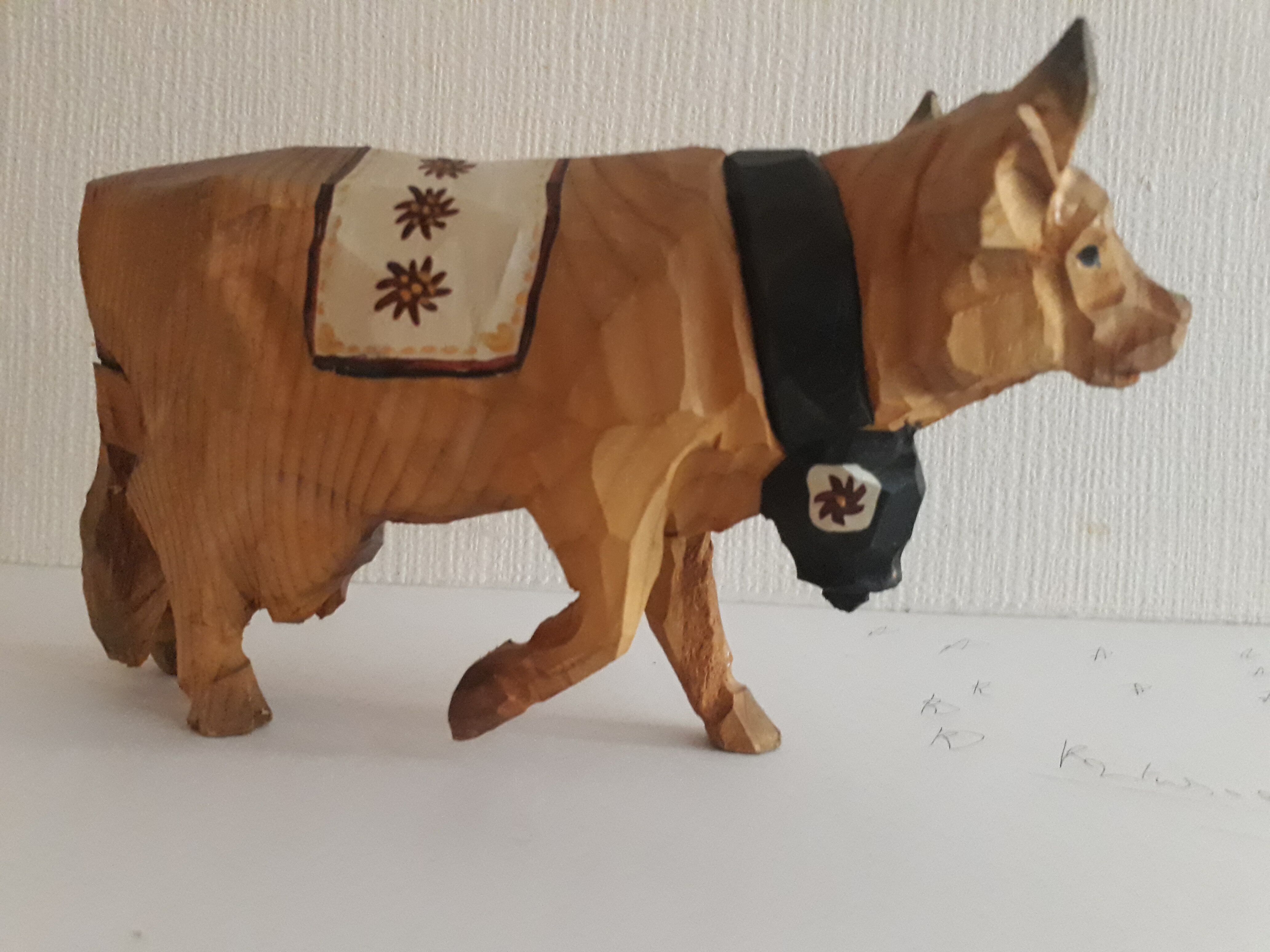 Carved and painted wooden cow