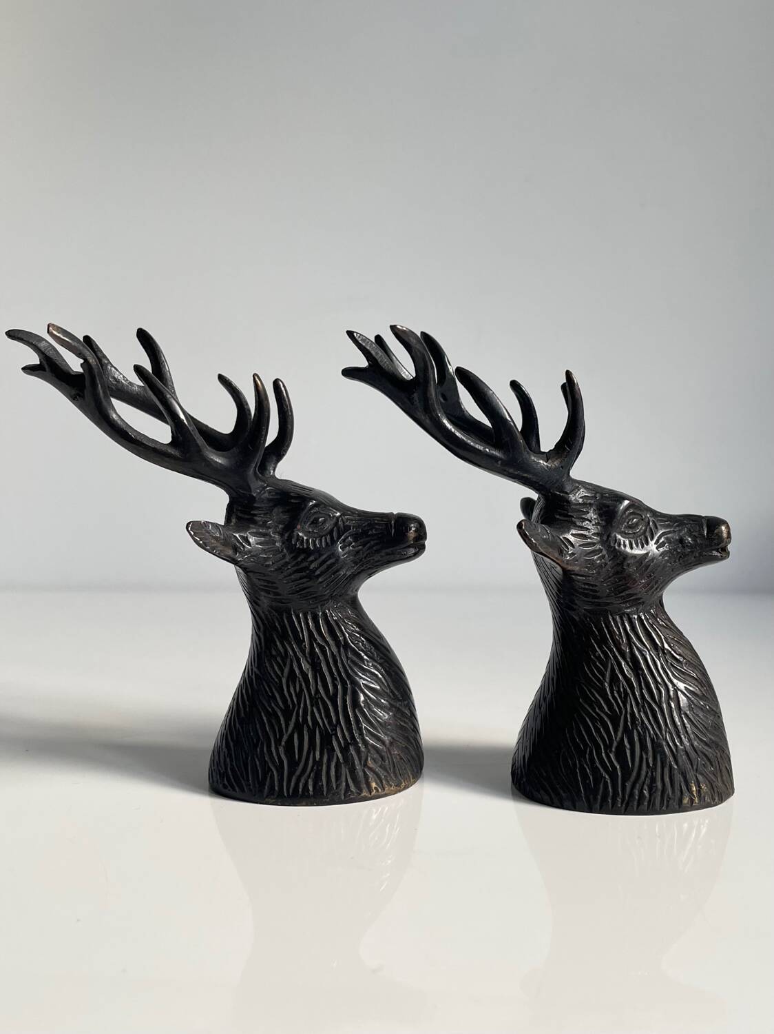 Salt and pepper shaker set with patinated brass deer heads.