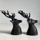 Salt and pepper shaker set with patinated brass deer heads.