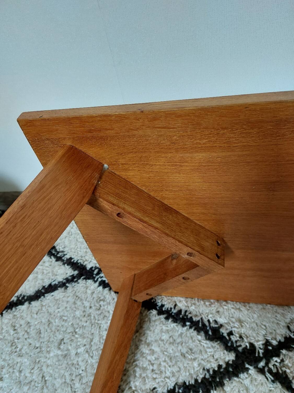 Coffee table with wooden compass legs