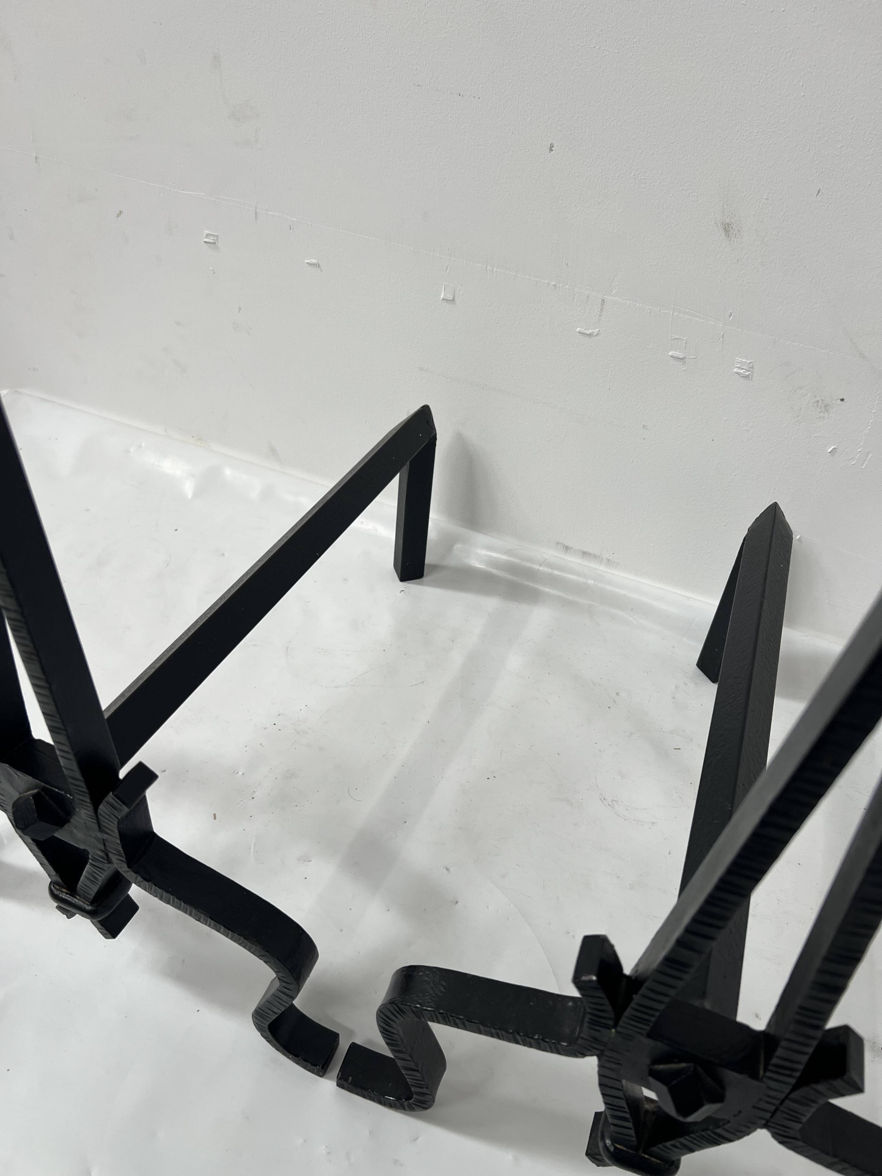 Pair of wrought and hammered iron bedside tables, 20th century