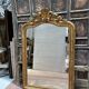 Louis XV style mirror in gilded wood and stucco, 20th century.