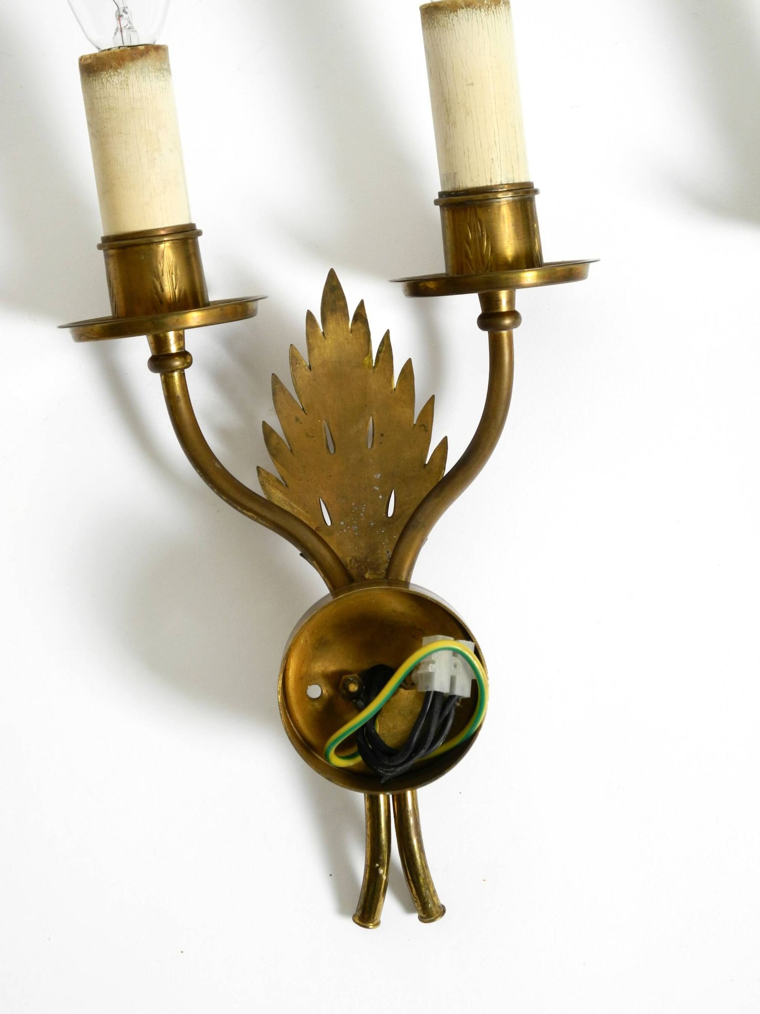 A pair of mid-century modern brass wall lamps by Vereinigte Werkstätten