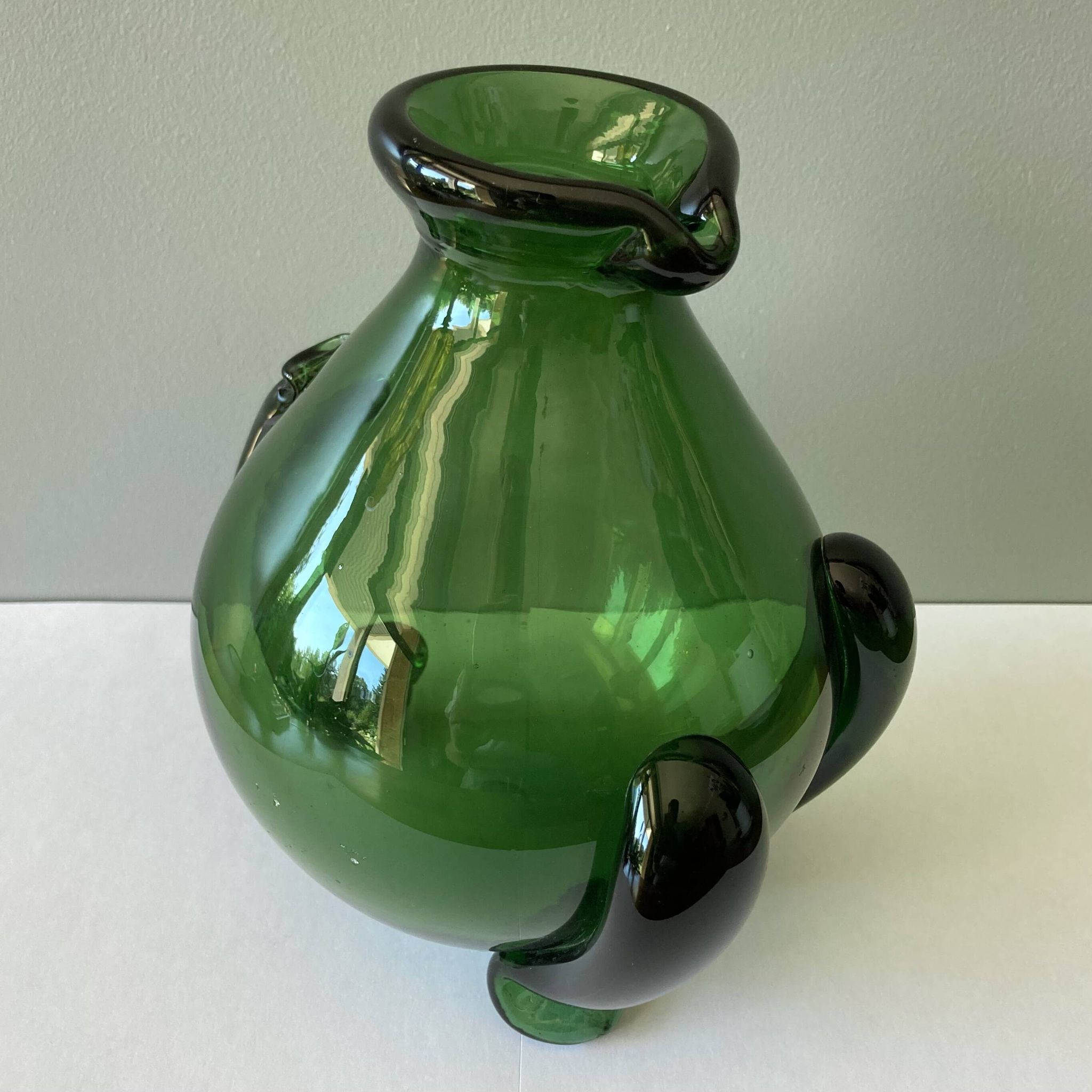 Amazing pitcher; vintage tripod jug or carafe in blown and hot-worked green glass