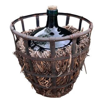 Demijohn with riveted iron basket