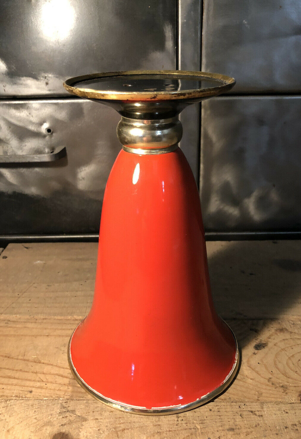 Cut vase on foot in red and black metal