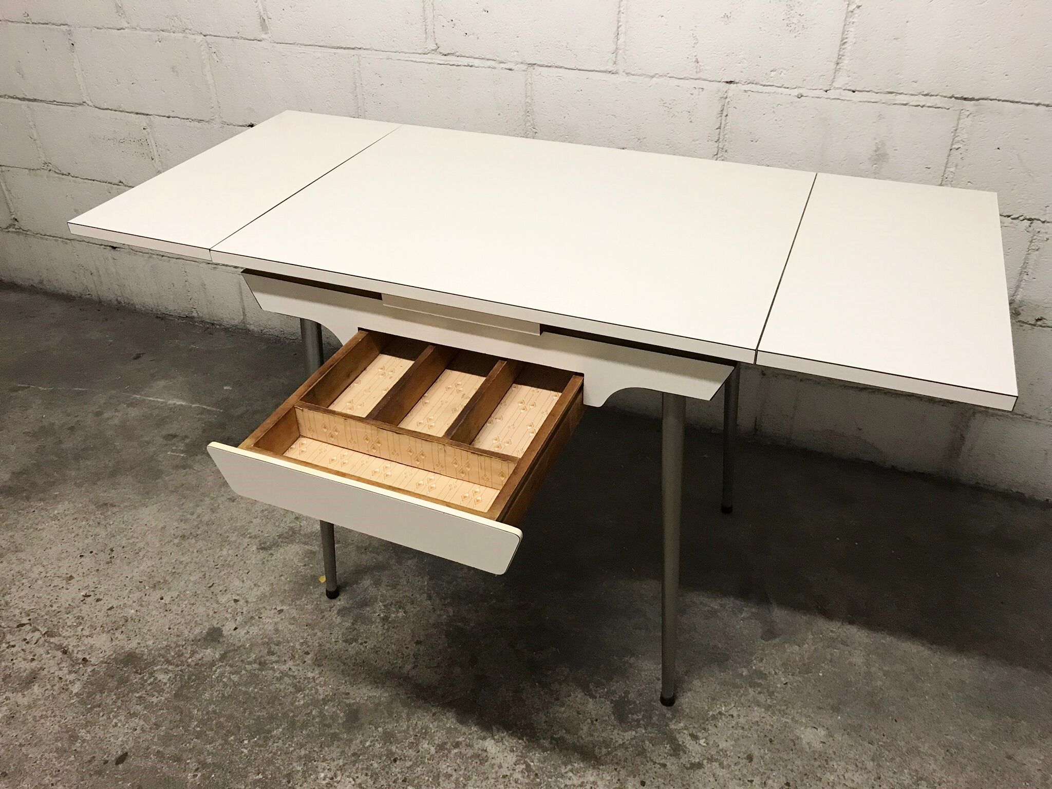 Off-white formica table / 70s cream with a tapered foot drawer