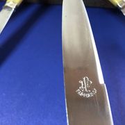 Coffret de 6 couteaux de table manche bakélite France début XXe