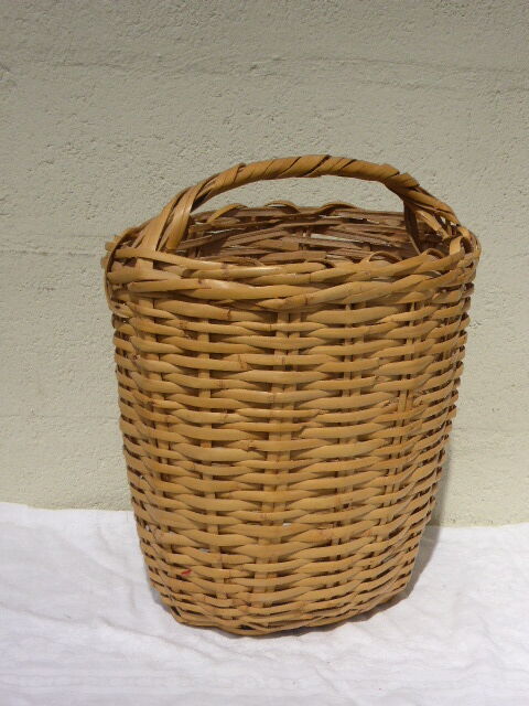 Basket has handles, braided vintage