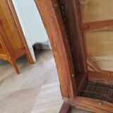 2 colonial-style armchairs in woven rattan and exotic wood