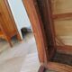 2 colonial-style armchairs in woven rattan and exotic wood