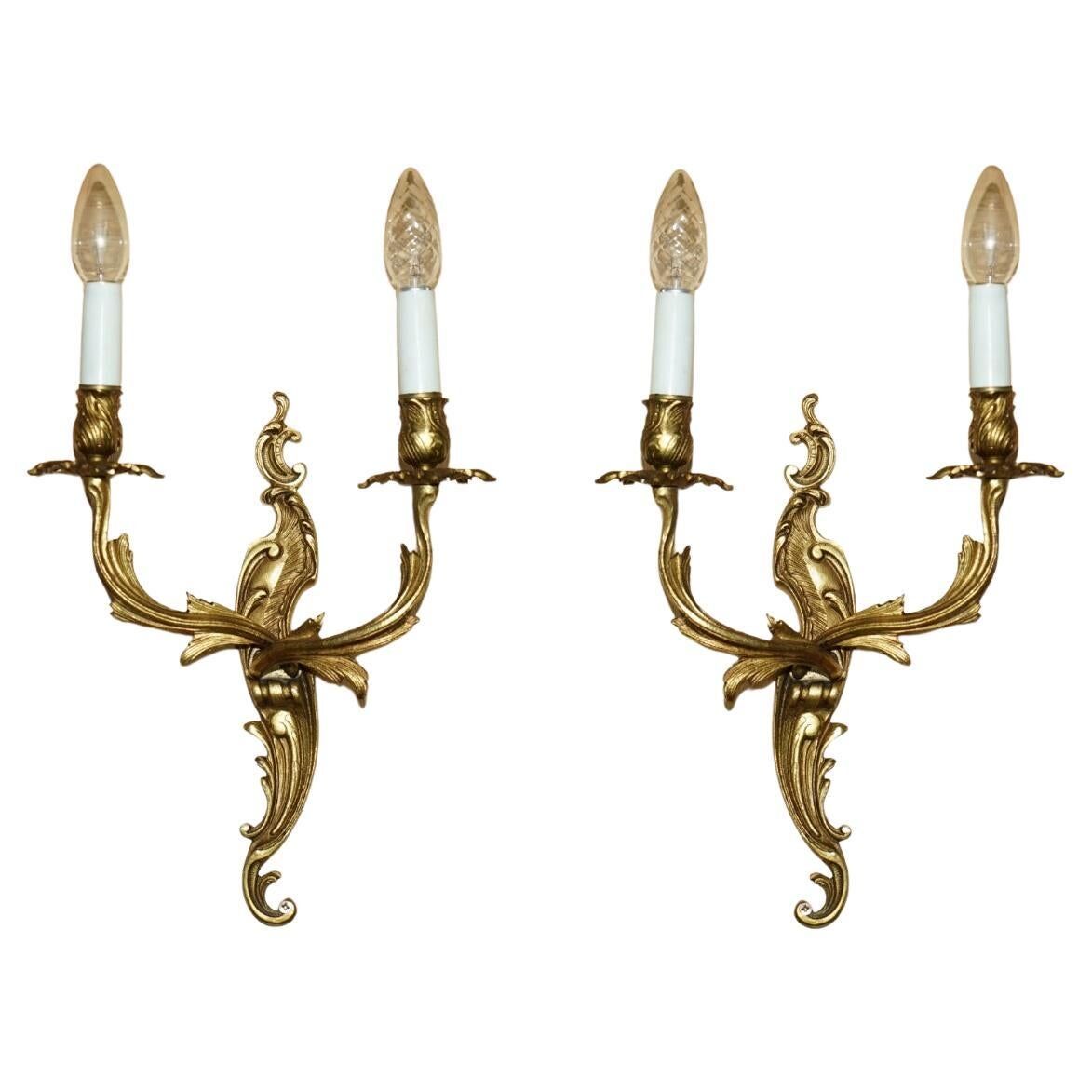 Pair of antique French wall sconces, gilded and bronzed, from the 1920s.