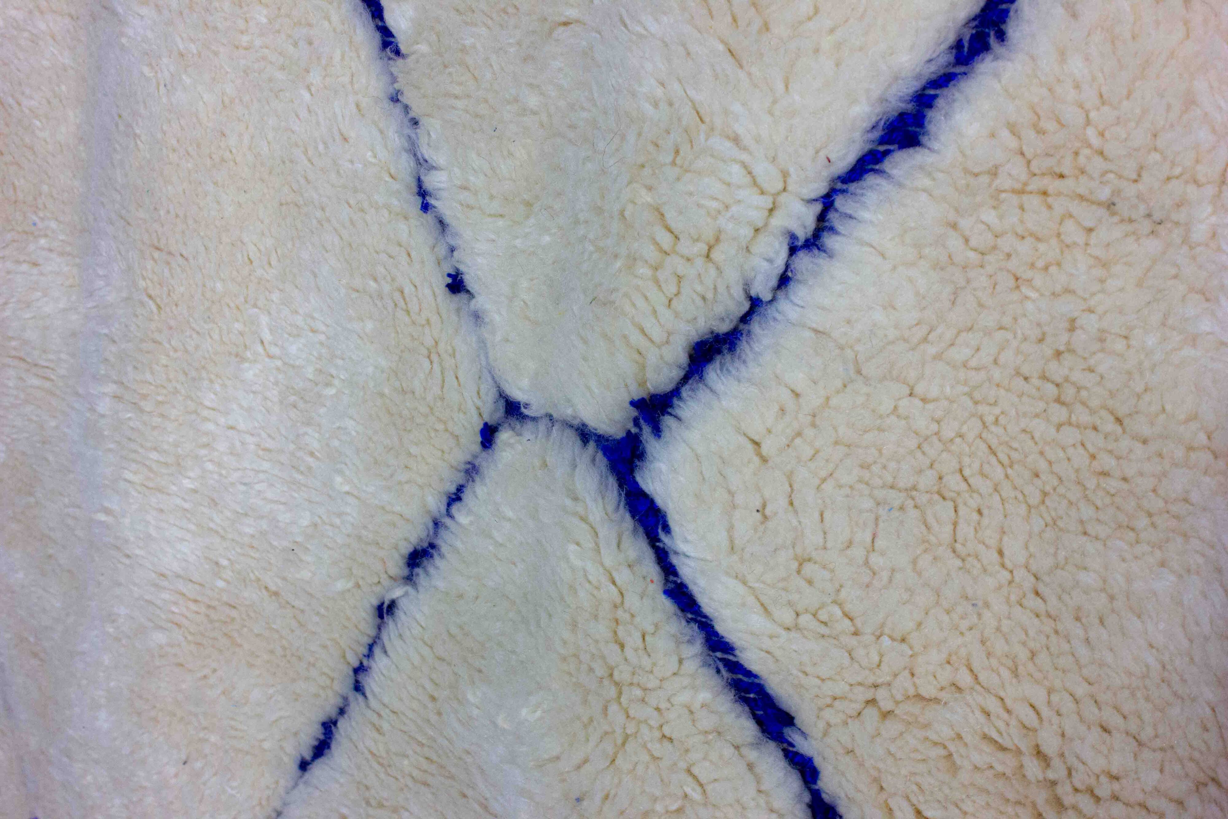 Vintage berber rug in ivory and blue wool
