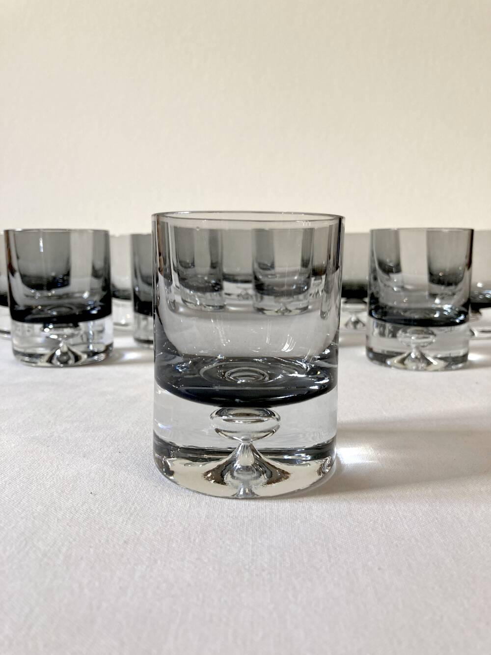 10 smoked glass aperitif glasses, 1960s-1970s