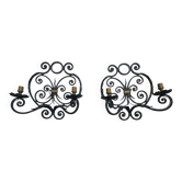 Old pair of wrought iron sconces in baroque style.