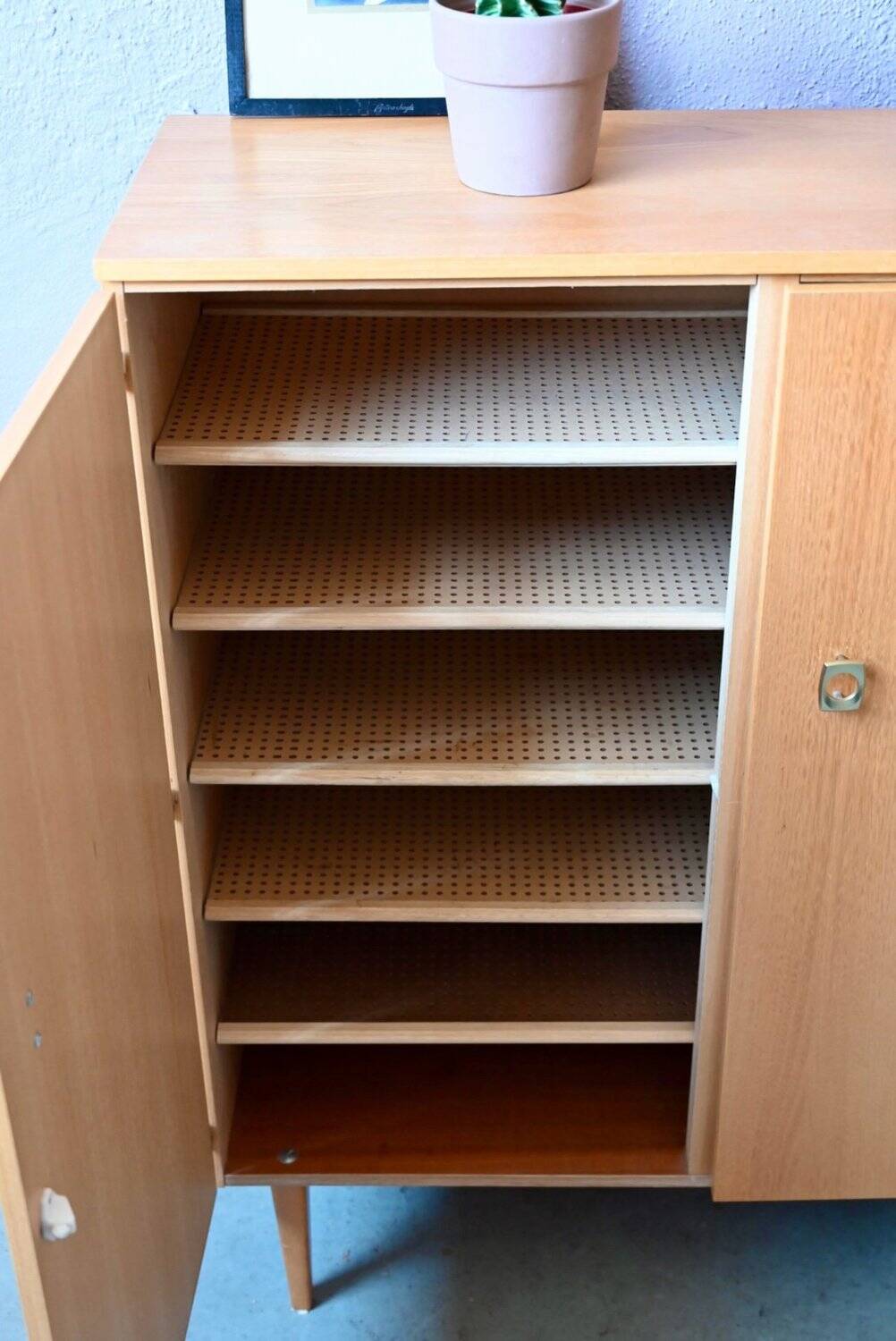 Vintage 1960s shoe cabinet in light wood and chrome metal.