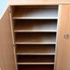 Vintage 1960s shoe cabinet in light wood and chrome metal.